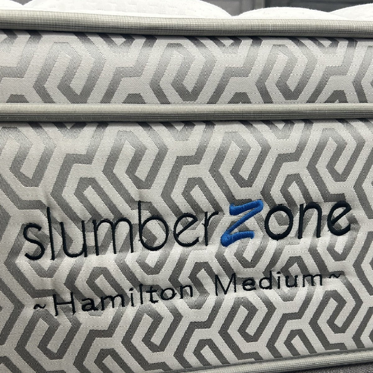 Hamilton Medium mattress side panel with embroidered Slumber Zone logo