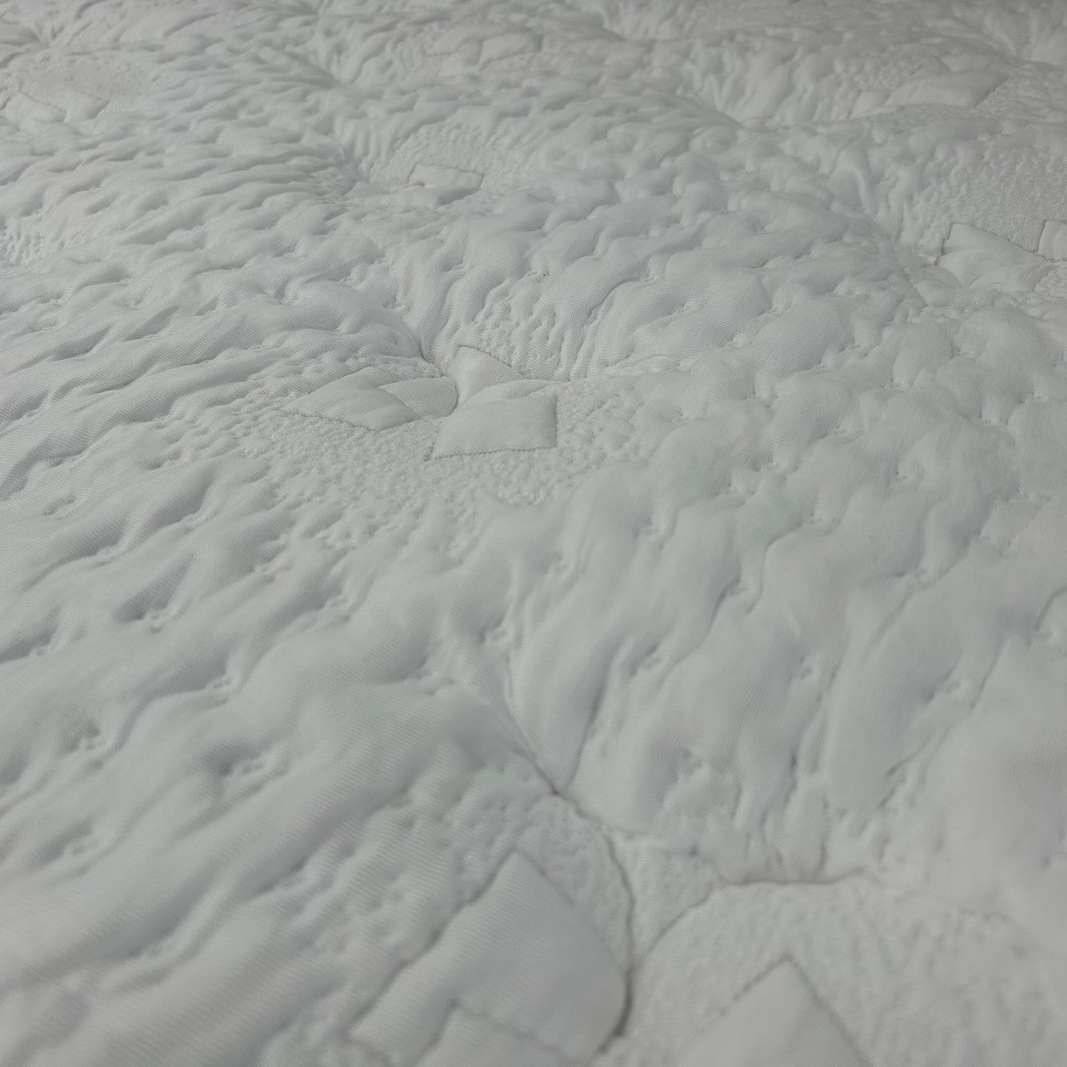 Close-up of the Heaven mattress quilted cooling knit cover